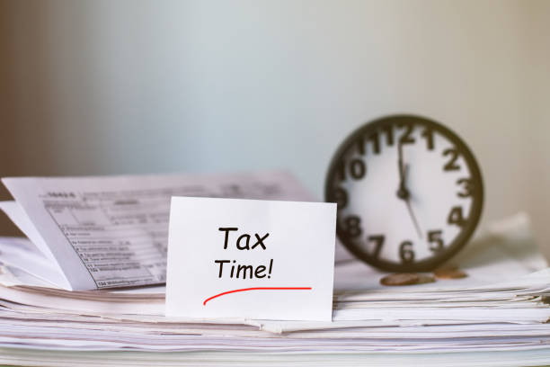 istock Tax Time Concept! Clock and Taxes Due reminder 669363632