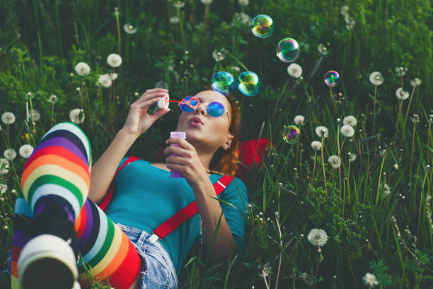 enjoying in springtime - bubble child bubble wand blowing imagens e fotografias de stock