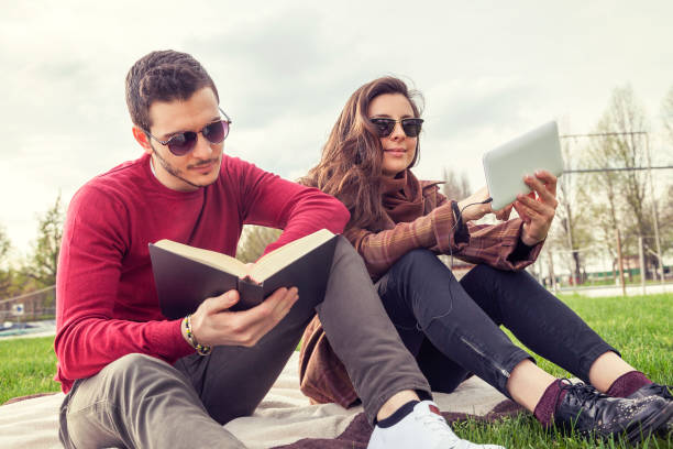 istock nice couple boyfriends relaxing on meadow 669371498