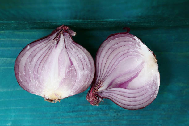 istock red onion close up photo whole and cut 669371680