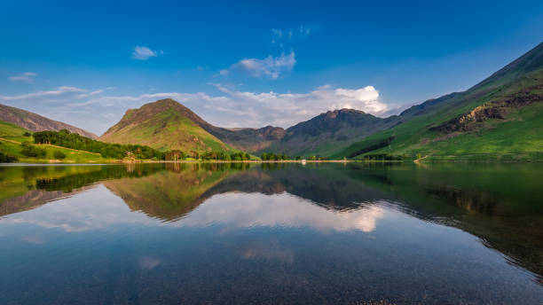 istock Stunning sunset at lake in District Lake in England 669374572