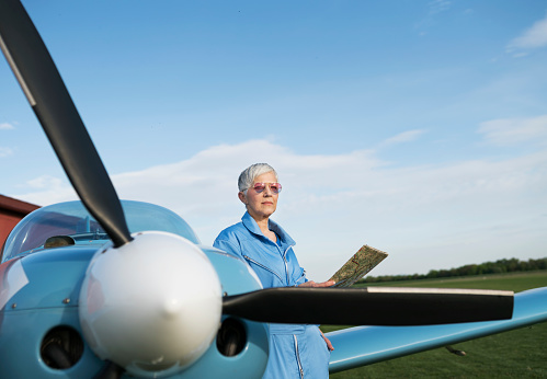 Woman pilot, preparing for flying
