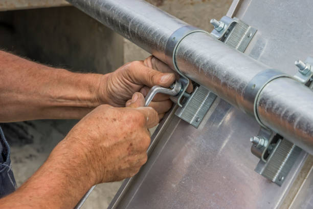 istock hand with a wrench tighten the nut 669387116
