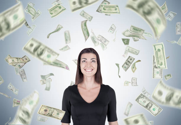 istock Happy black haired woman and dollar rain 669390184