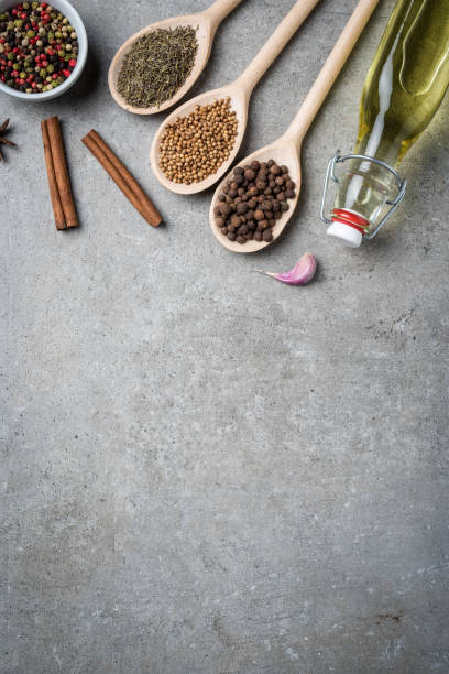 istock Fresh herbs and spices on gray stone table. 669390548