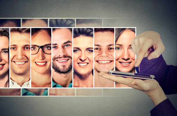 istock man hand with smartphone sending group sms to his friends 669394398