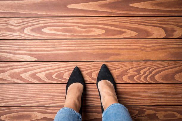 Woman standing on wooden floor Woman standing on wooden floor. Top view dress shoe photos stock pictures, royalty-free photos & images