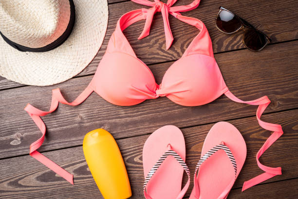 istock Swimsuit on wooden background 669397008
