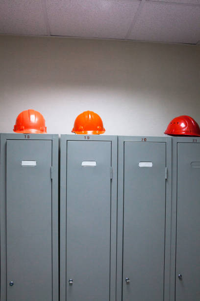 istock Metal lockers and plastic hard hats 669406216
