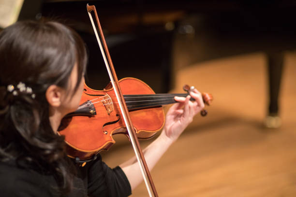 istock Woman playing violin 669412524