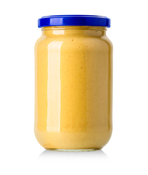 istock Glass jar of mustard 669413100