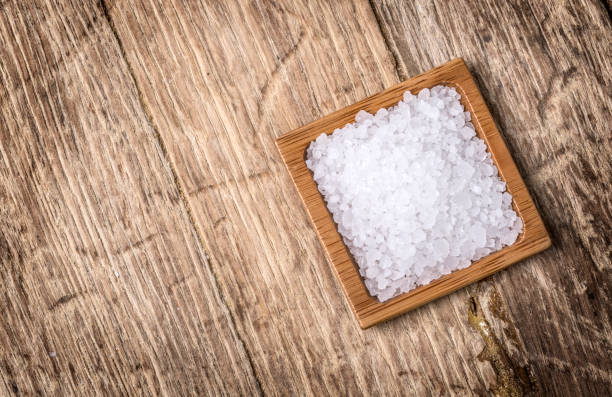 istock sea salt in wooden bowl 669413556