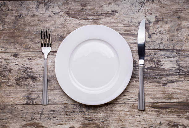 istock Mock up plate on wooden table 669413580