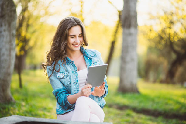 istock teenager girl using tablet 669420242