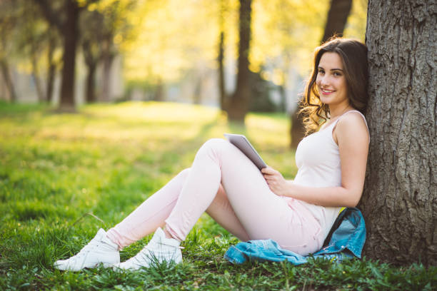 istock teenager girl using tablet 669420244