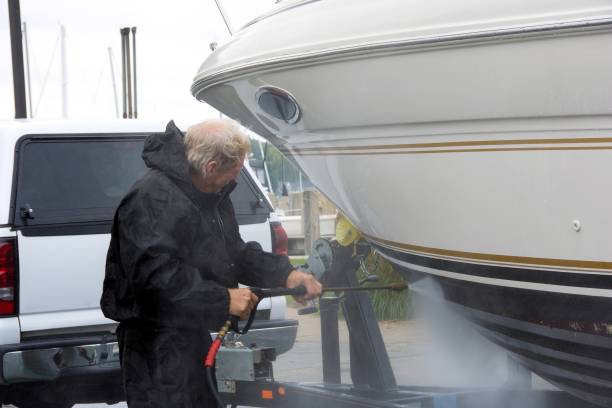 istock man power washing power boat 669431214