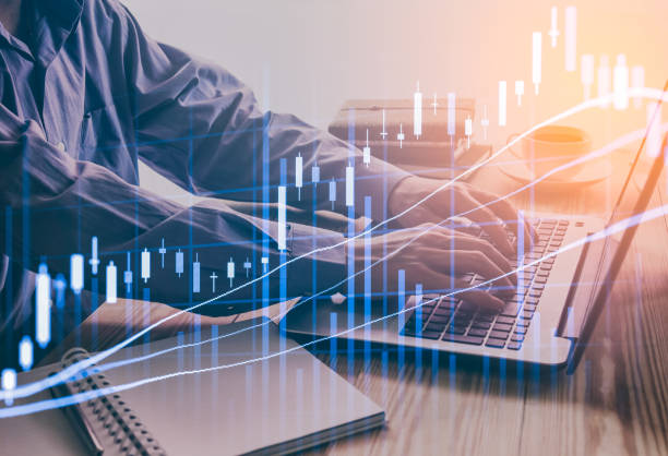 istock Double exposure business man on stock financial exchange. 669431426