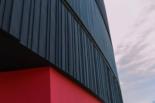 istock Black metal and red stone building 669433752