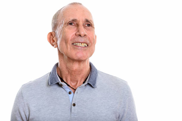 istock Close up of happy senior man smiling while thinking 669434272