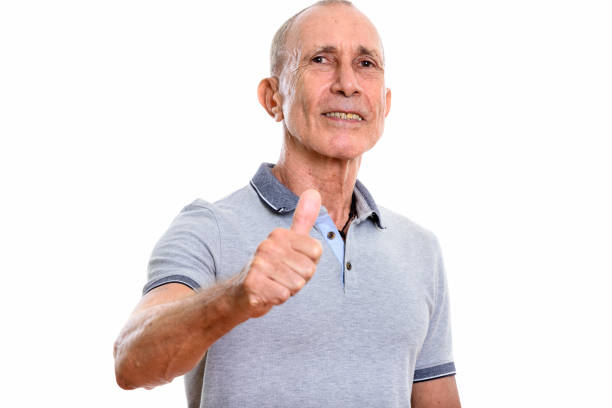 istock Studio shot of happy senior man smiling while giving thumb up 669434322