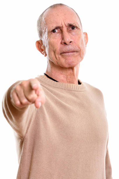 istock Angry senior man pointing finger at camera 669434542