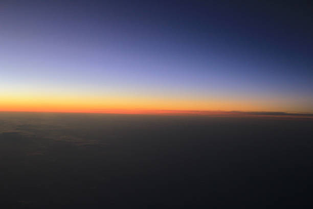 istock Amazing view from plane on the sky, sunset sun and clouds 669437204