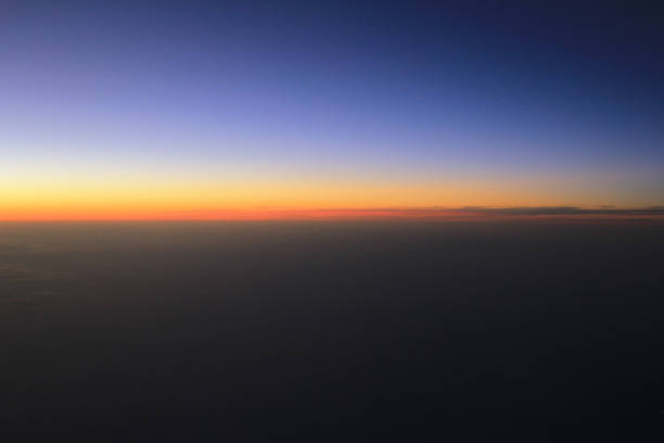 istock Amazing view from plane on the sky, sunset sun and clouds 669437236