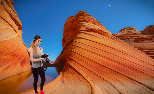Woman photographer taking photo at the The Wave Arizona