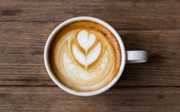 istock cup of coffee on wood table blackground 669437538