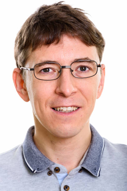 istock Face of happy man smiling while wearing eyeglasses 669438150