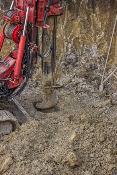 istock Drilling hole in ground with ground hole drilling machine 669438222