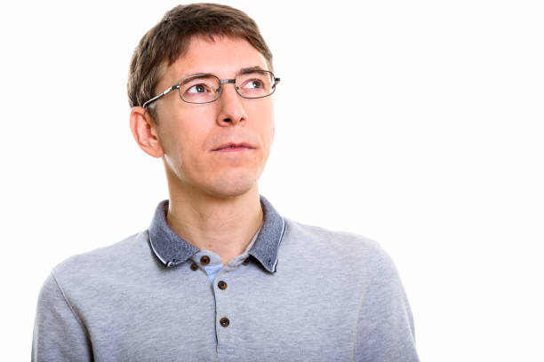 istock Close up of man thinking against white background 669438256