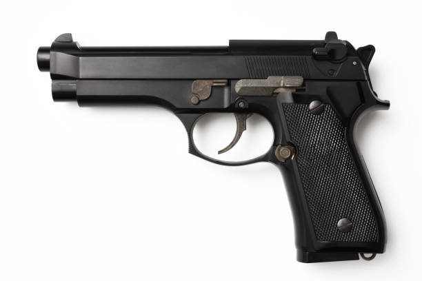 colpo isolato di pistola nera su sfondo bianco - handgun foto e immagini stock