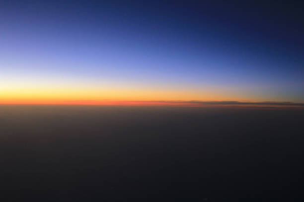istock Amazing view from plane on the sky, sunset sun and clouds 669447984