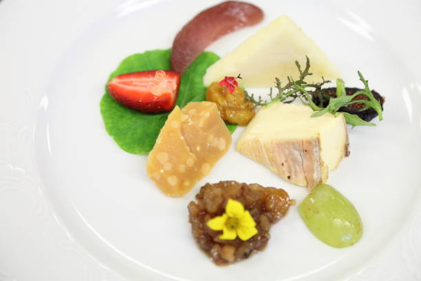 istock Cheese course, aged gouda, taleggio, parmesan, fig, pear, grape, relish, compote, strawberry, pearls. 669449086