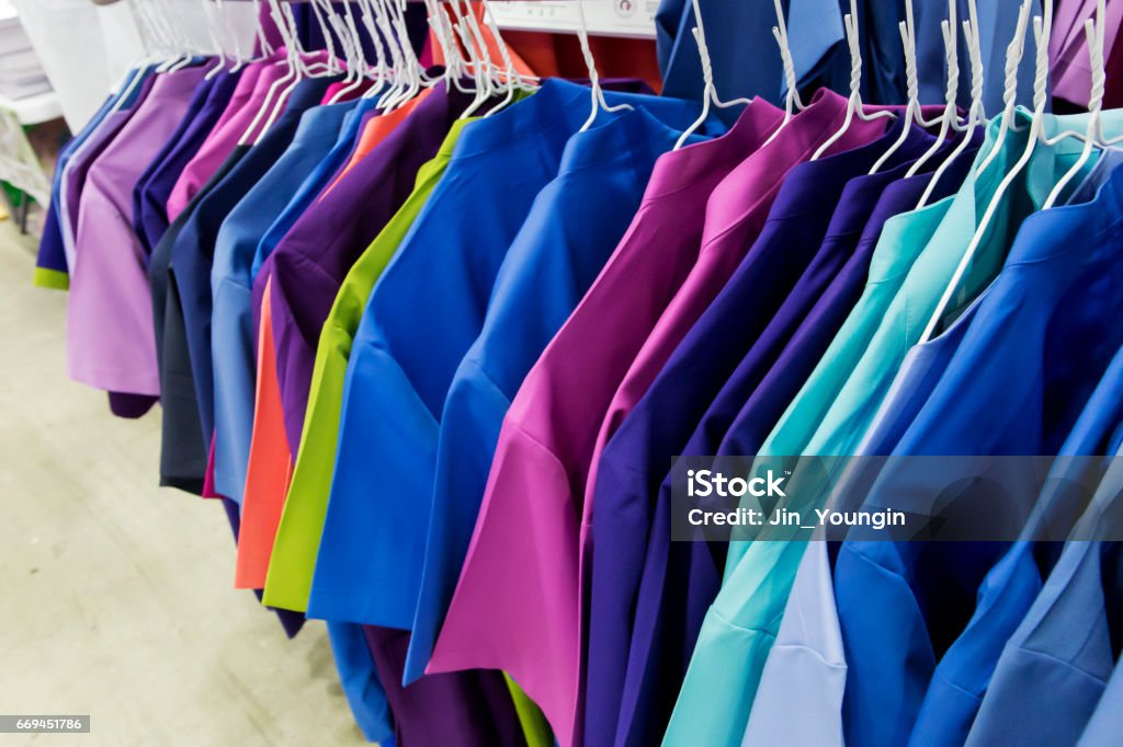 Row of nurse uniform' hanging Uniform Stock Photo