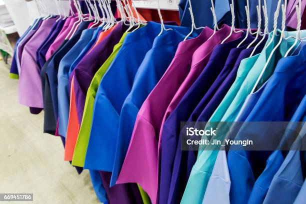 Row Of Nurse Uniform Hanging Stock Photo - Download Image Now - Uniform, Clothing, Nurse