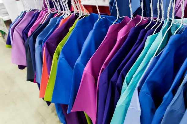 Photo of Row of nurse uniform' hanging