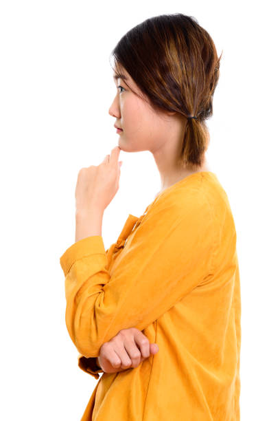 istock Profile view of young beautiful Asian woman thinking 669452502