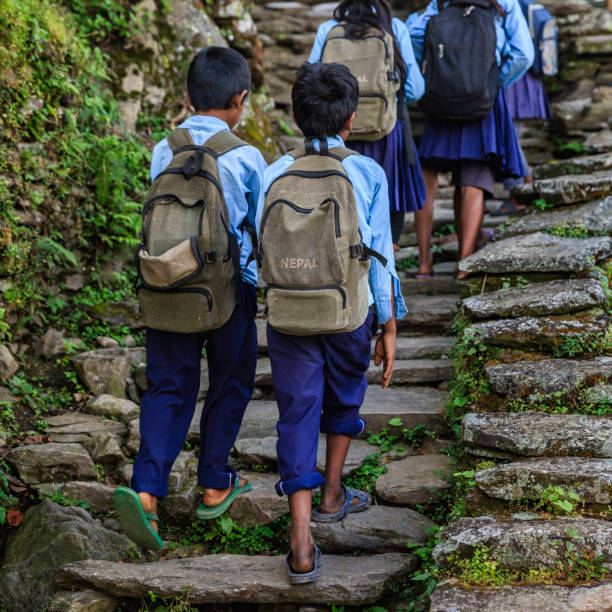 Group of Nepali school children  in village near Annapurna Range Group of Nepali school children in village in Annapurna Conservation Area. The Annapurna region is in western Nepal where some of the most popular treks (Annapurna Sanctuary Trek, Annapurna Circuit) are located. Peaks in the Annapurnas include 8,091m Annapurna I, Nilgiri and Machhapuchchhre. The Annapurna peaks are among the world's most dangerous mountains to climb. annapurna circuit photos stock pictures, royalty-free photos & images
