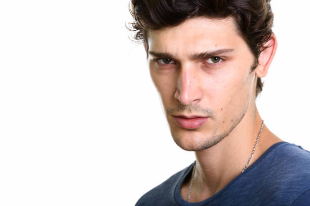 Close up of young handsome man looking angry horizontal shot