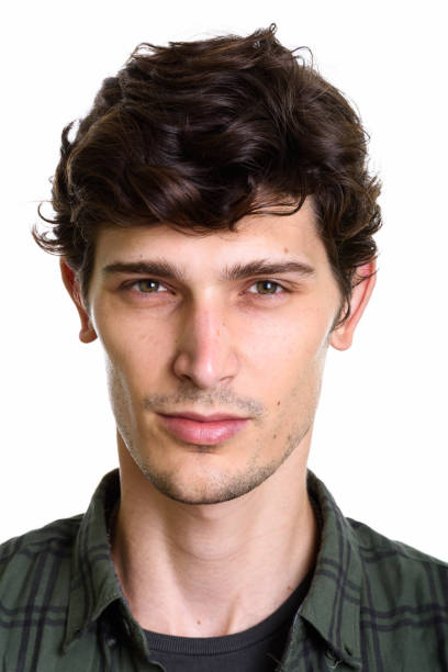 istock Face of young handsome man against white background 669459558