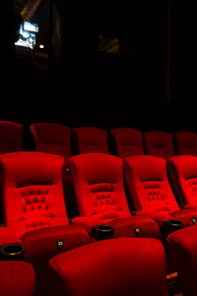 istock Empty comfortable red seats with numbers in cinema 669462462