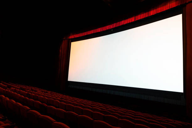 istock cinema screen with open red seats 669462534