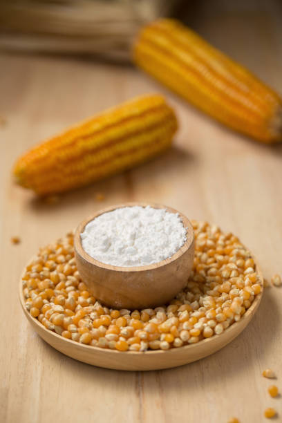 istock Corn flour in a bowl over a wooden table 669467208