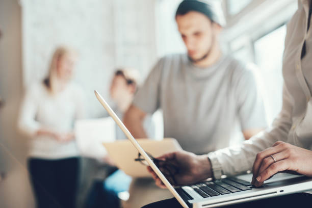 Young business team working in loft office stock photo