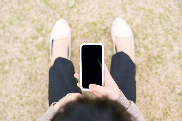 istock Woman holding a smartphone 669473708