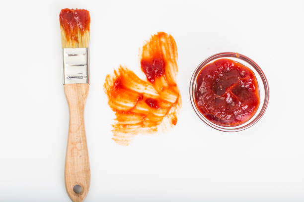 istock Abstract brush ketchup on white background 669474488