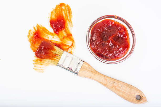 istock Abstract brush ketchup on white background 669474510