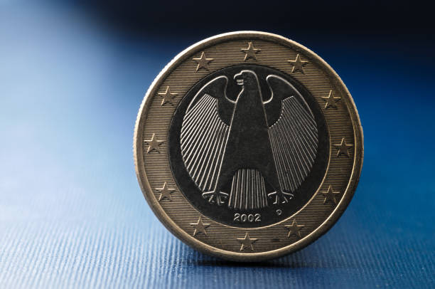 close up of a one euro coin from the european union member germany - european union coin european union currency coin isolated objects imagens e fotografias de stock